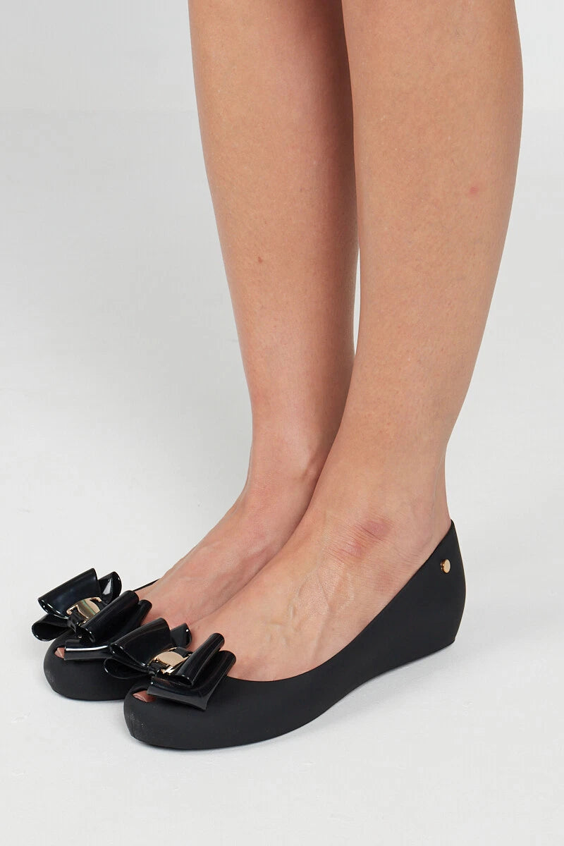 Jada Ladies Slip-On Women's Jelly Flats with Peep Toe and Bow Detail