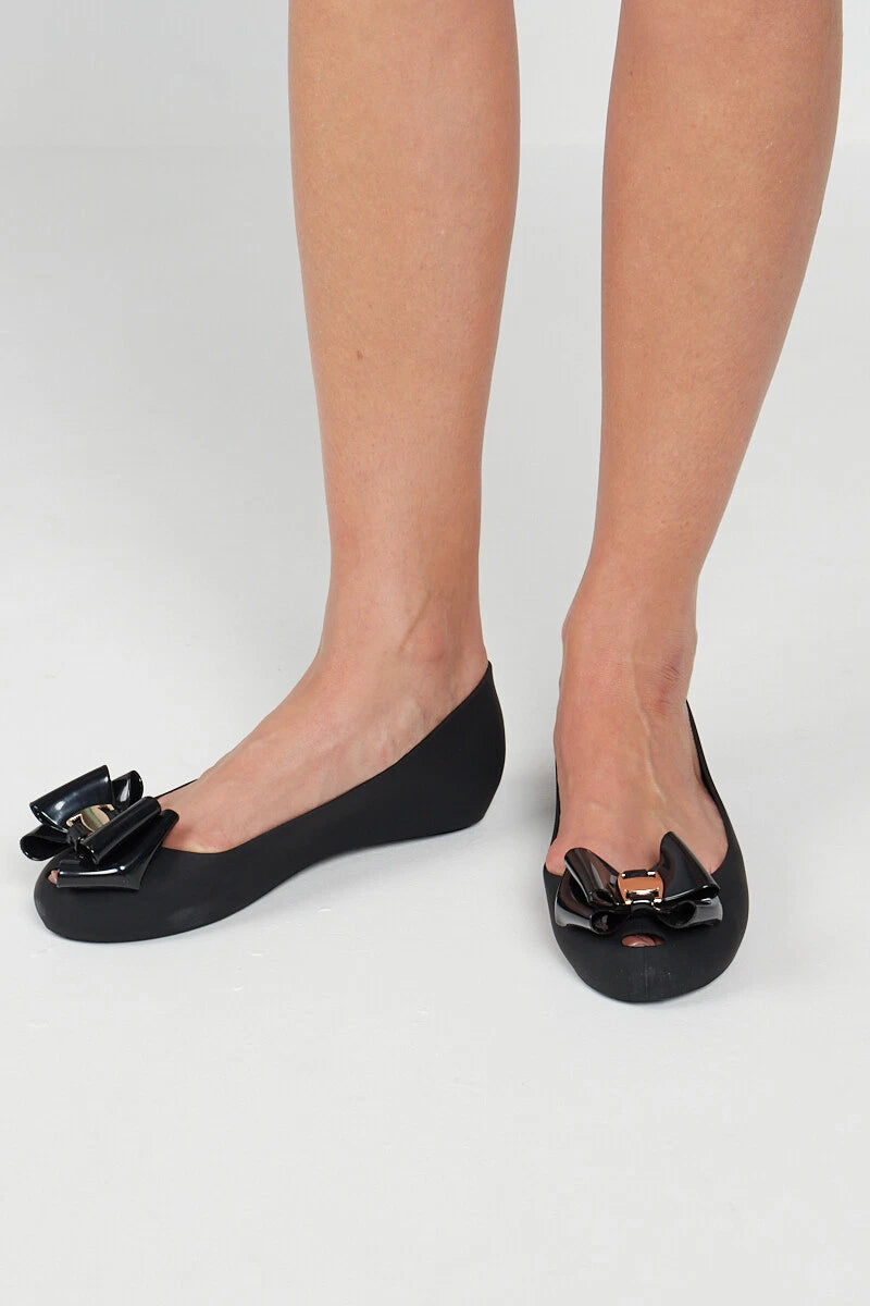 Jada Ladies Slip-On Women's Jelly Flats with Peep Toe and Bow Detail