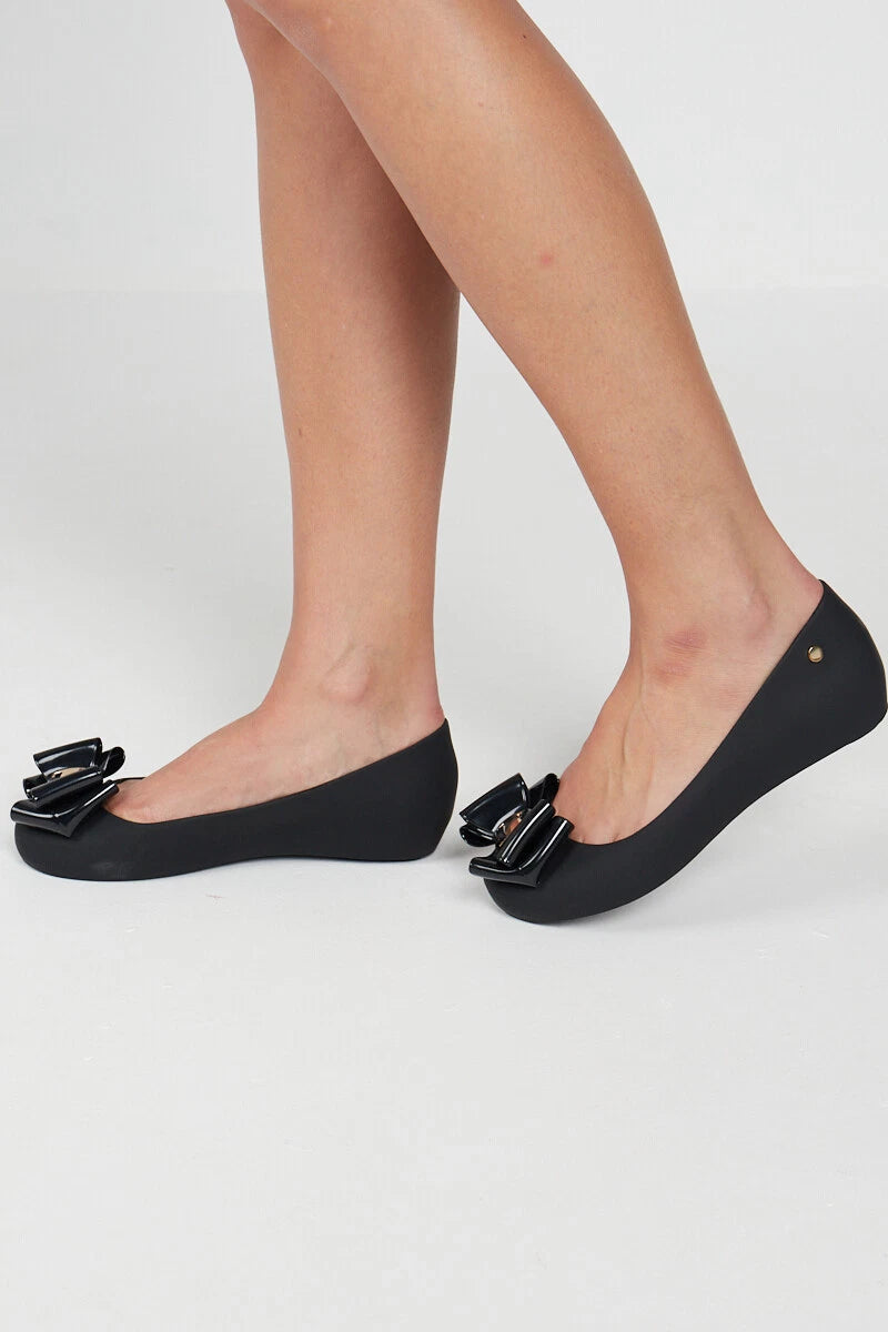 Jada Ladies Slip-On Women's Jelly Flats with Peep Toe and Bow Detail