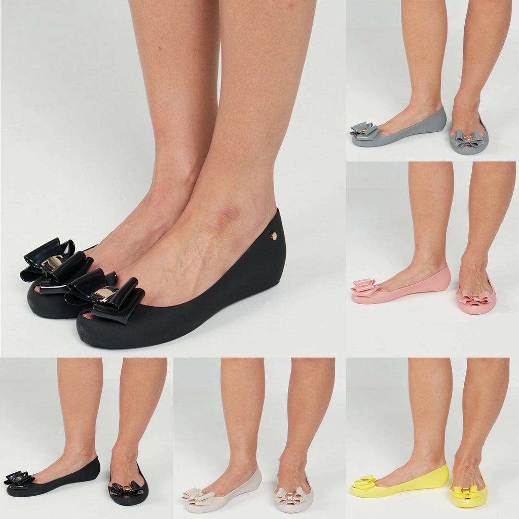Jada Ladies Slip-On Women's Jelly Flats with Peep Toe and Bow Detail